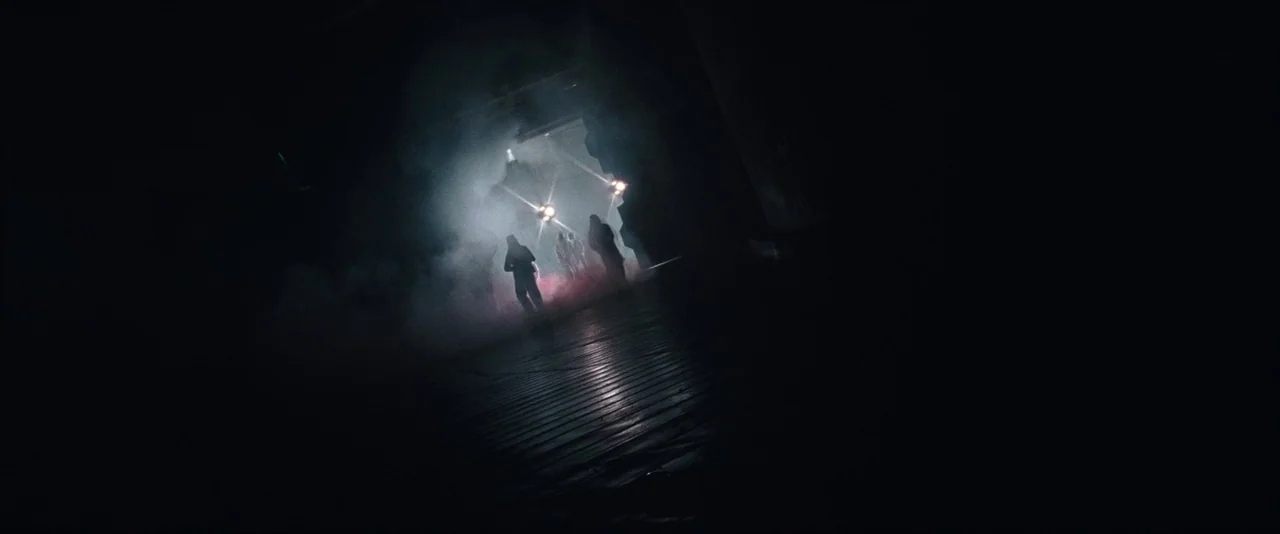 Resident Evil: Apocalypse (2004) movie still: wide — A dark industrial loading dock area filled with rolling clouds of thick white smoke.…