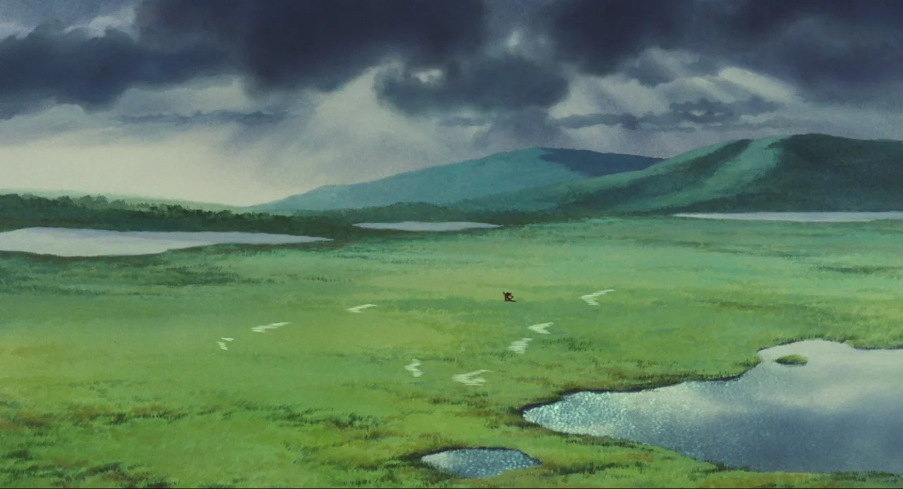 Princess Mononoke (1997) movie still: establishing — A vast, green wetland area stretches toward distant hills under a dark, overcast sky. Multiple…