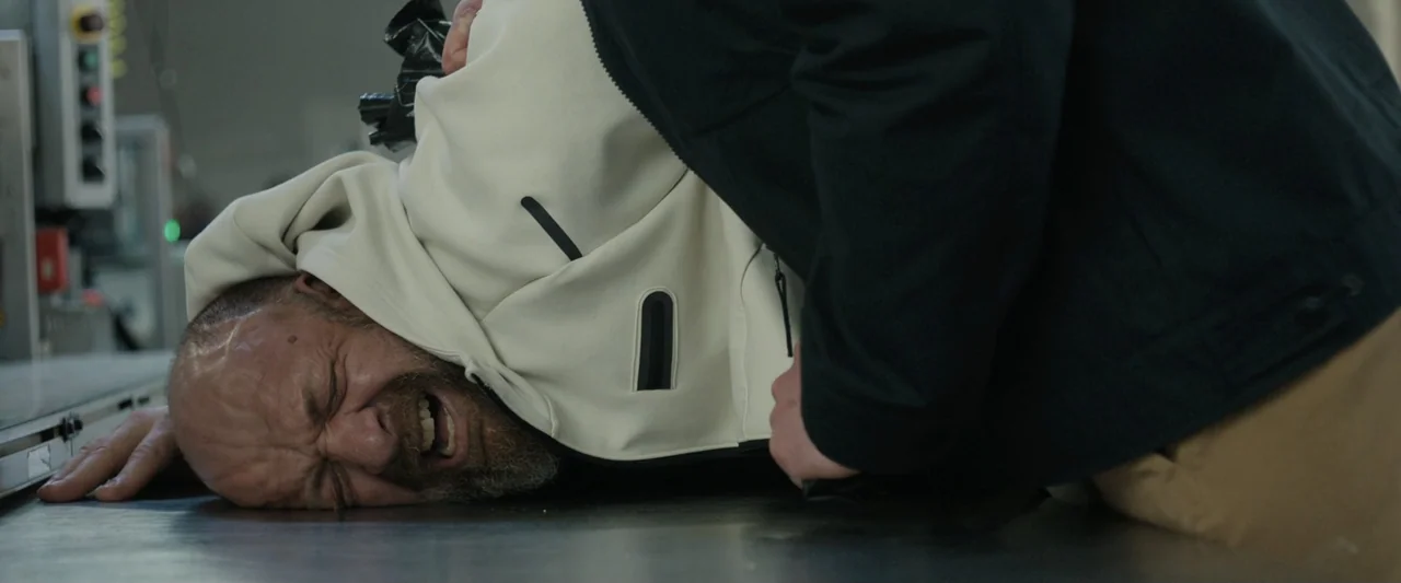 True Account: Breaking the Truce (Yakuza Bloody Chronicles 2) (2007) movie still: medium — A sterile industrial area features a metallic workspace…