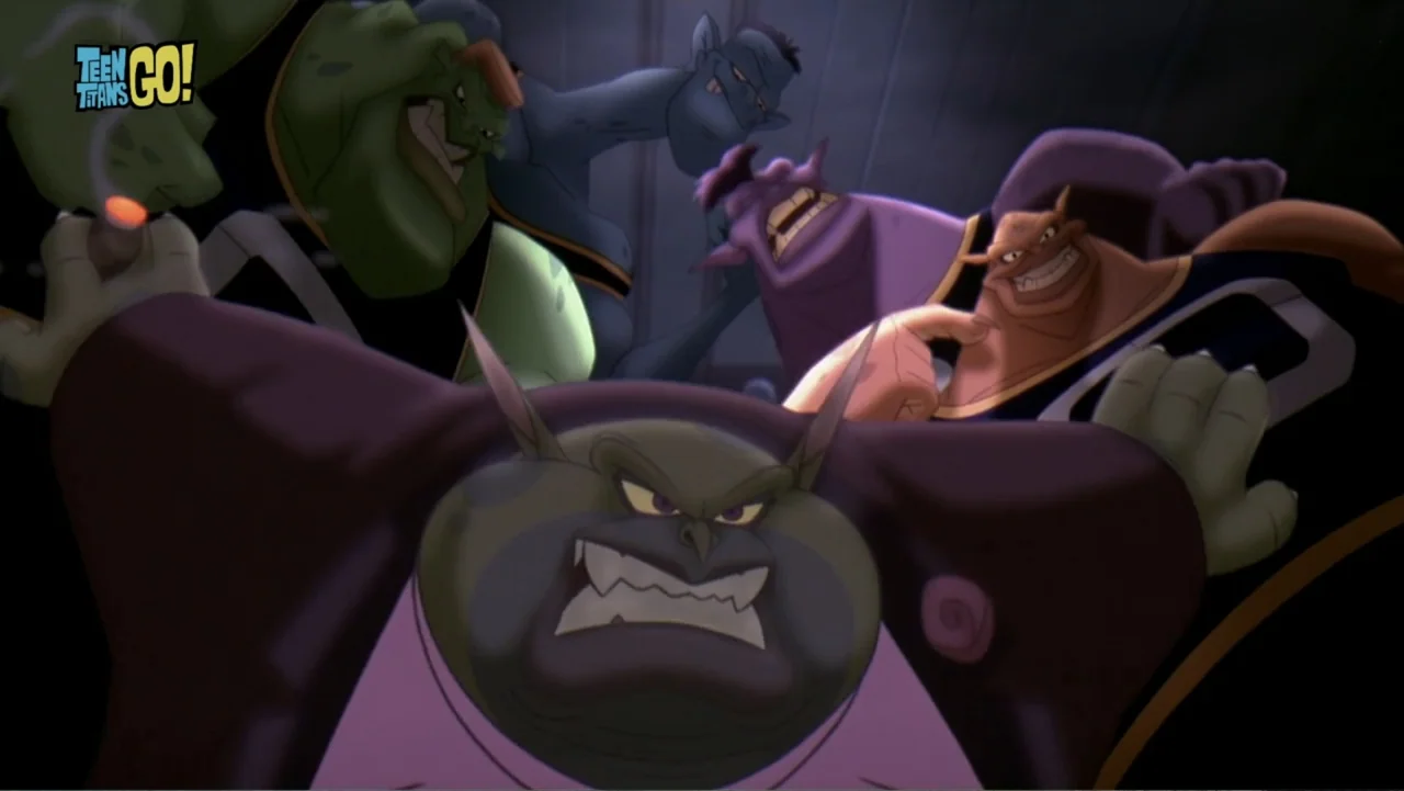 Teen Titans Go! To the Movies (2018) movie still: medium — A group of distinct fantasy creatures stands in a dimly lit narrow corridor. The monsters…
