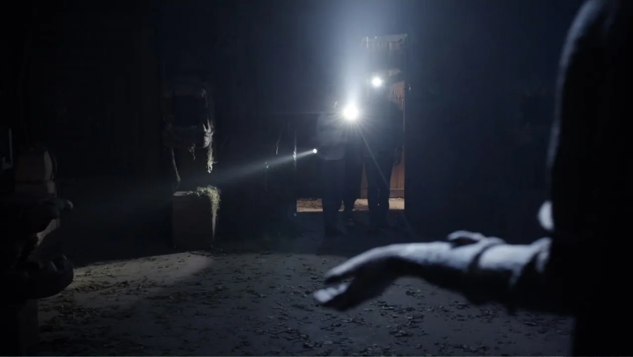 Legends of the Hidden Temple (2016) movie still: medium — A dark dusty interior filled with debris and scattered leaves on the floor. Two figures…