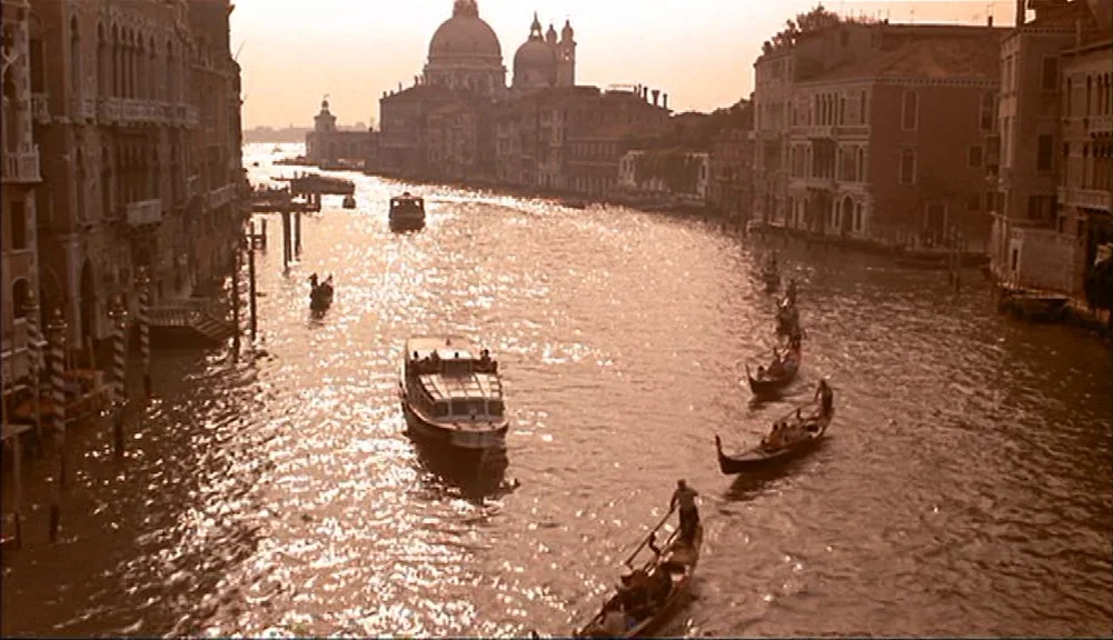 The Mirror Has Two Faces (1996) movie still: establishing — The Grand Canal in Venice is lined with historic stone buildings and churches. Multiple…