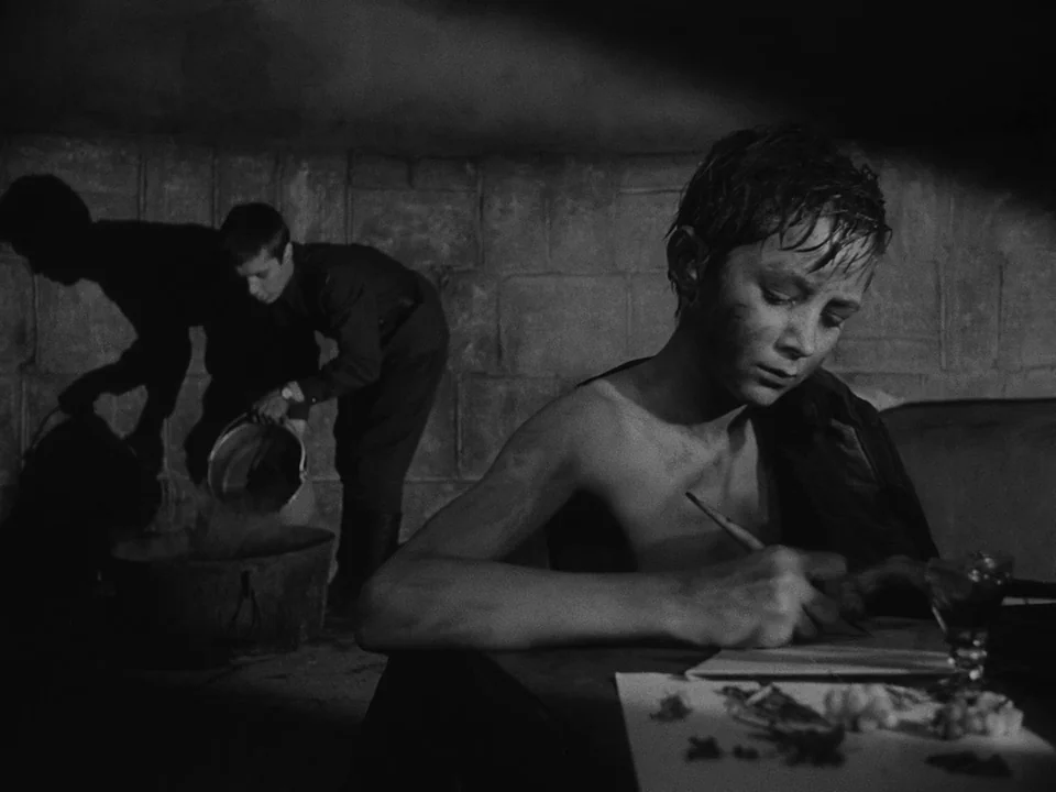 Ivan’s Childhood (1962) movie still: medium — A dimly lit stone masonry chamber with shadows stretching across the rough brick walls. A shirtless…