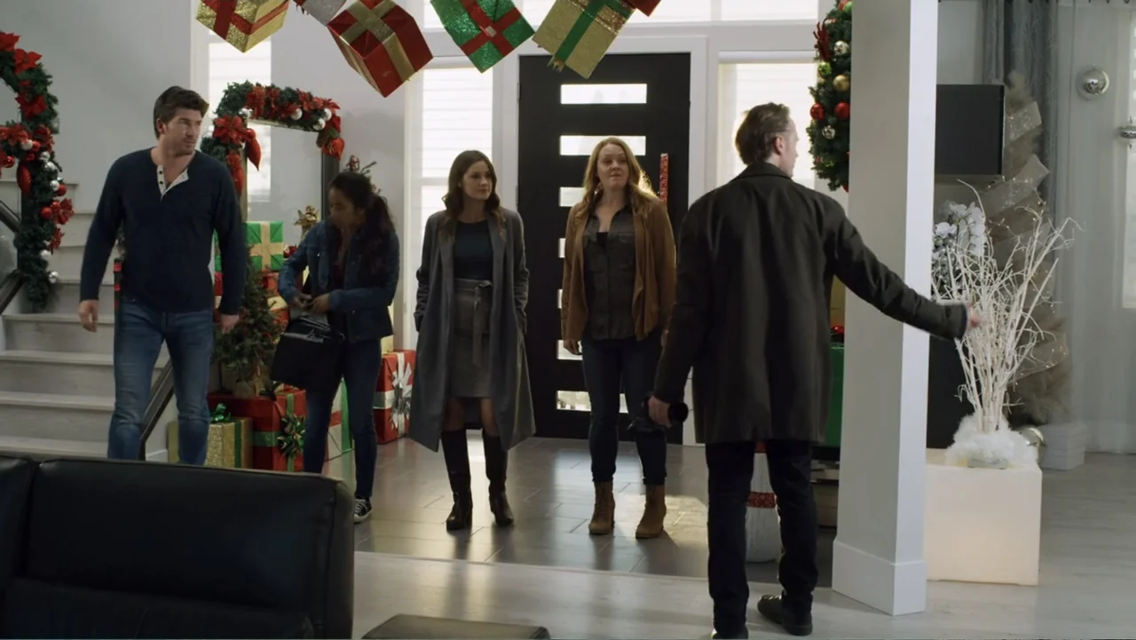 Always and Forever Christmas (2019) movie still: fullbody — A spacious home interior decorated for the holidays with Christmas gifts and wreaths.…