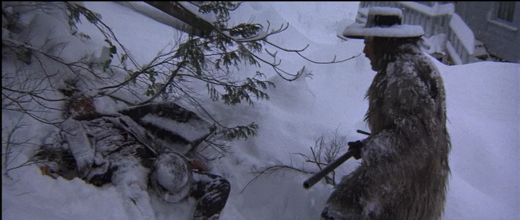 McCabe & Mrs.Miller (1971) movie still: medium — A steep mountainside is completely covered in a thick, deep layer of fresh snow. A man in a fur…