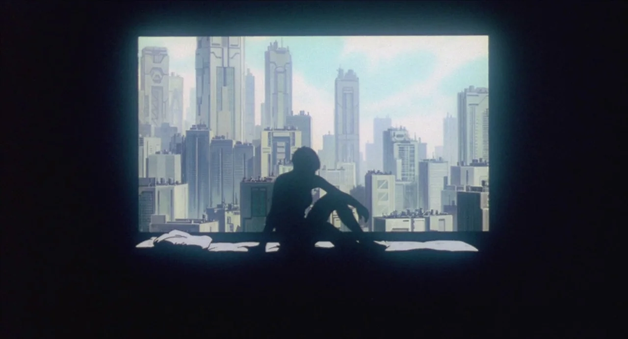 Ghost in the Shell (1995) movie still: wide — A high-rise apartment overlooks a sprawling, dense city of futuristic, multi-story buildings. A single…
