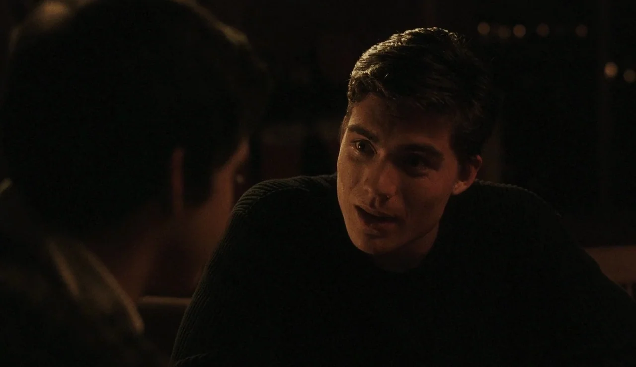 The Perks of Being A Wallflower (2012) movie still: medium — A dark environment with blurred background lights indicating a night setting. A young…