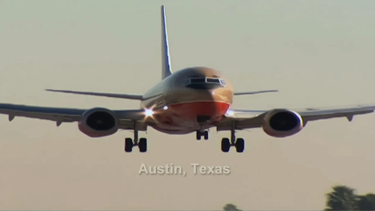 Finding Amelia (2024) movie still: wide — A passenger airplane approaches a runway in a clear bright environment. The plane has landing gear…