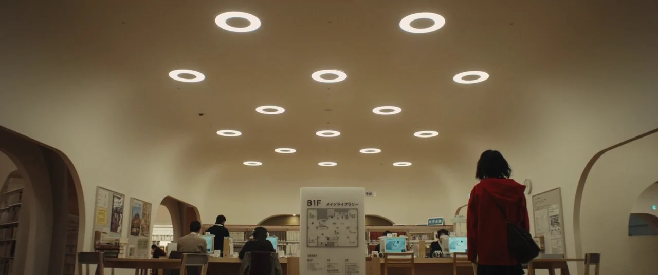 Kumiko the Treasure Hunter (2014) movie still: wide — A spacious library interior features rounded ceiling arches and distinct circular light…