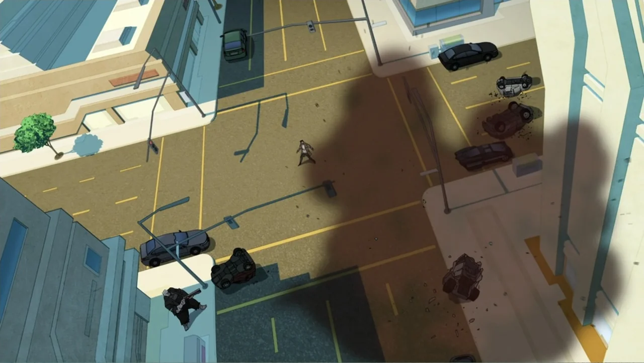 Legion of Super-Heroes (2023) movie still: wide — A city intersection features multiple overturned cars scattered across the asphalt and concrete…