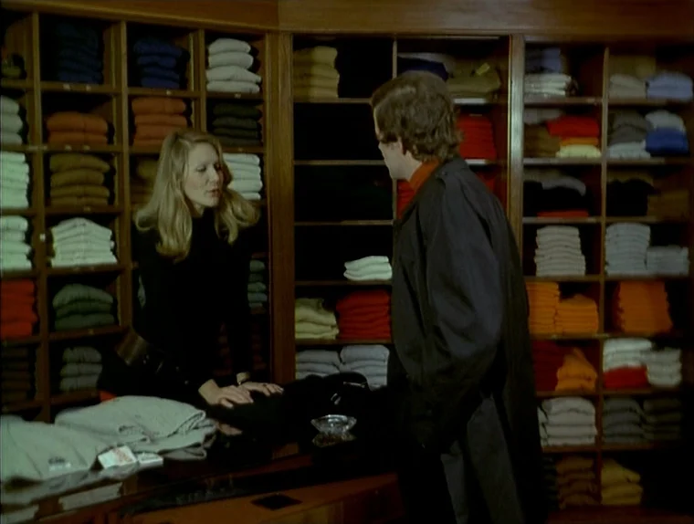 Love In The Afternoon (Chloe In The Afternoon) (L’amour l’après-midi) (1972) movie still: medium — A clothing store features wooden shelving units…