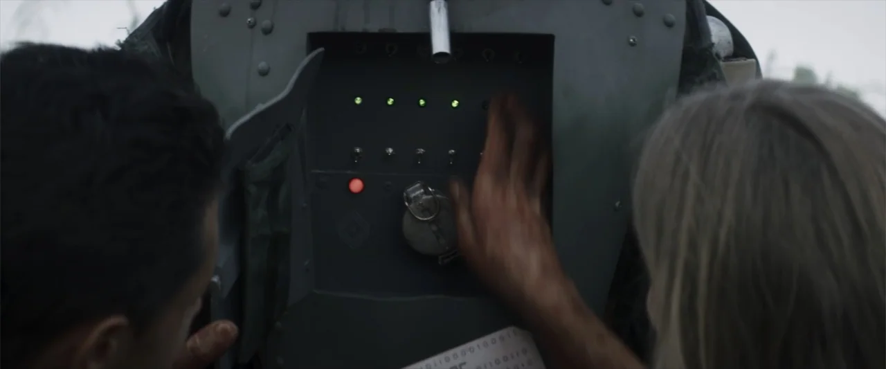 Treblinka's Last Witness (2012) movie still: closeup — A close-up view of a metal control panel with illuminated switches and buttons. Two…