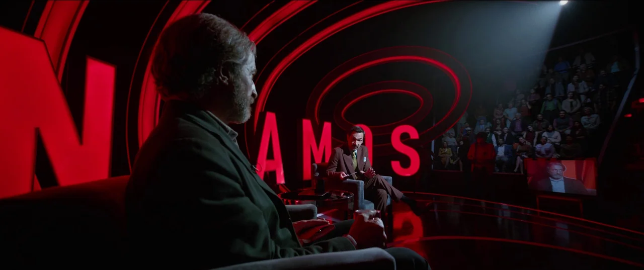 Bardo: False Chronicle of a Handful of Truths (2022) movie still: medium — A television set features large red glowing letters against a dark…