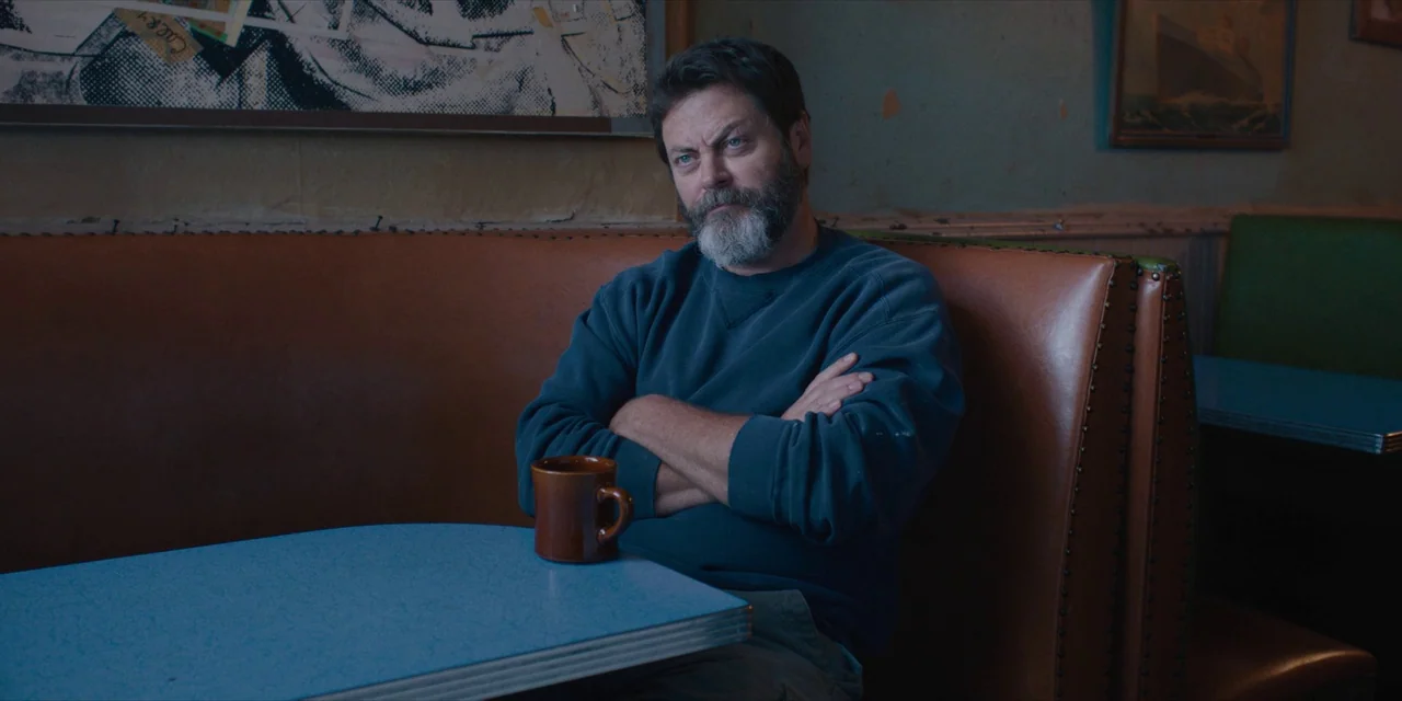 Hearts Beat Loud (2018) movie still: medium — A corner booth in a vintage diner features worn leather upholstery and laminate tabletops. A bearded…