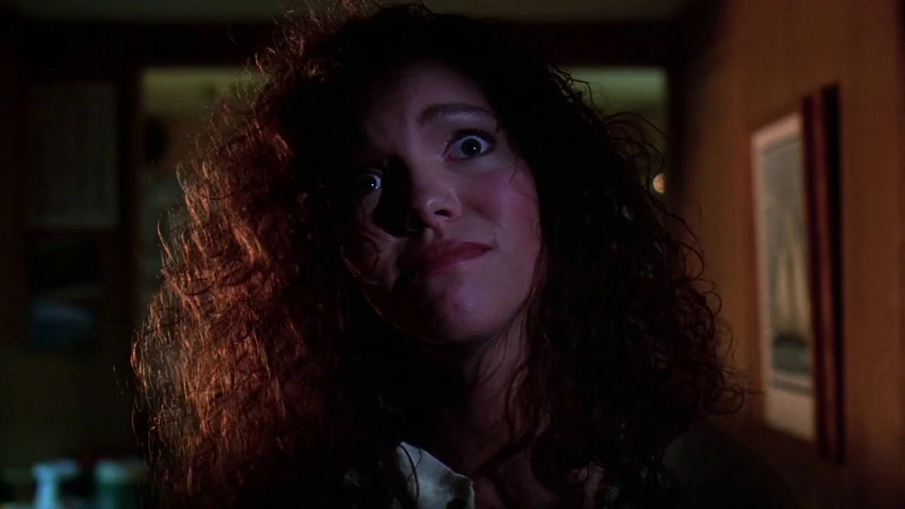 Friday the 13th Part VIII: Jason Takes Manhattan (1989) movie still: closeup — The interior setting features a dark room with a single framed…