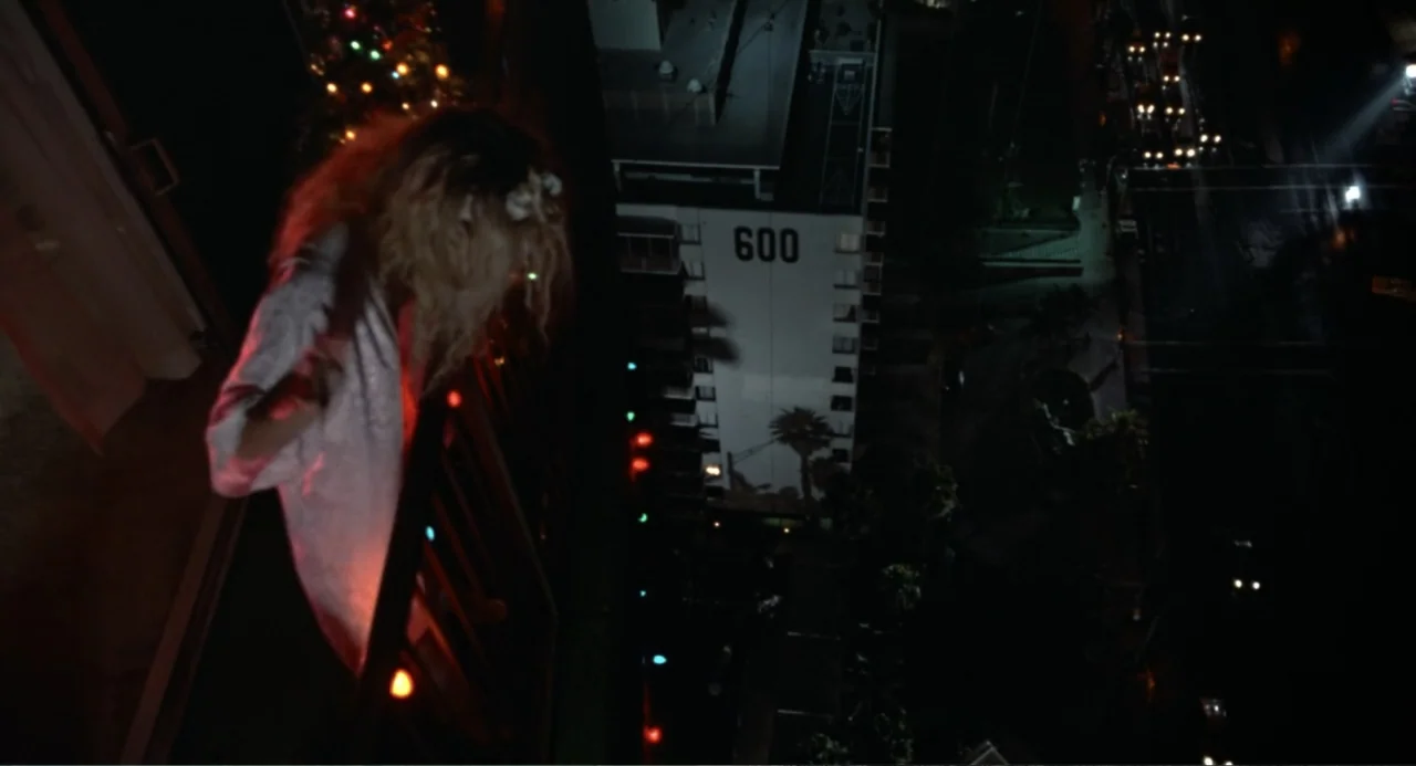 Lethal Weapon (1987) movie still: medium — A high-angle view from a balcony at night looking down toward a street.
