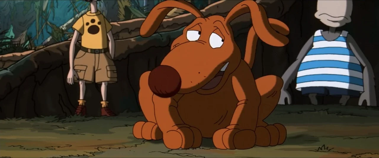 Rugrats Go Wild (2003) movie still: medium — A clearing in a dense jungle with overgrown foliage and tree trunks. A cartoon dog sits in the…