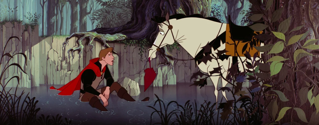 Sleeping Beauty (1959) movie still: wide — A man sits in a shallow stream next to a rocky cliff in a forest. A white horse stands in the water…