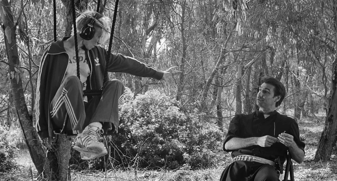 The Legend Of Kaspar Hauser (2012) movie still: medium — A dense grove of eucalyptus trees provides an intricate backdrop of branches and leaves. A…