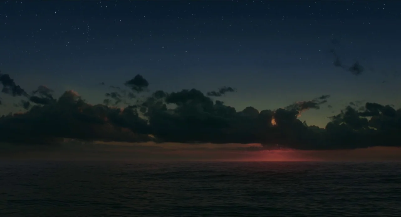 Life of Pi (2012) movie still: establishing — A vast expanse of ocean is visible under a starry predawn sky. A long horizontal band of dark clouds…