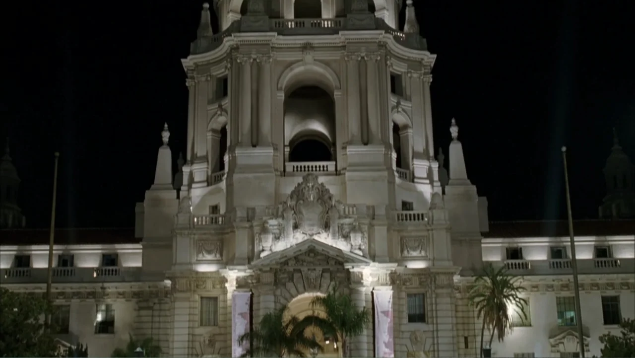 Rumor Has It... (2005) movie still: establishing — The Pasadena City Hall is shown at night with detailed architectural features and arches.…