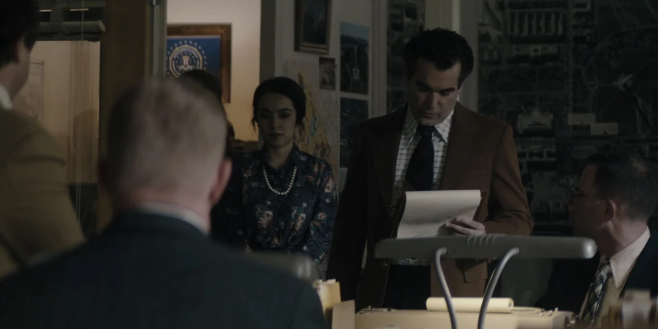 Mark Felt: The Man Who Brought Down the White House (2017) movie still: medium — A 1970s administrative office contains file cabinets, maps on the…