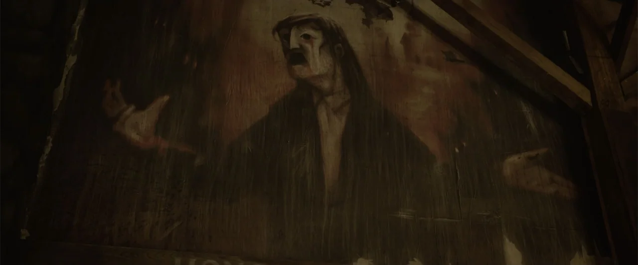 Ghosts of the Ozarks (2022) movie still: medium — A dark wooden attic wall features a large, weathered painting of a man. The figure in the portrait…
