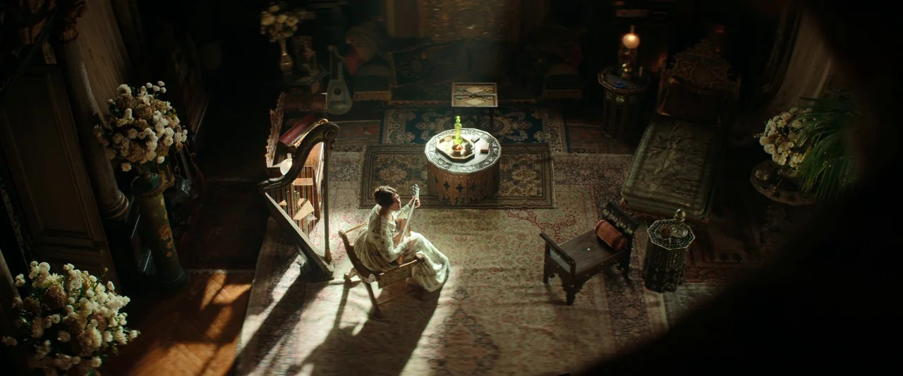 The Count of Monte-Cristo (2024) movie still: wide — A lavish Victorian-style room is filled with ornate wooden furniture and intricate patterned…