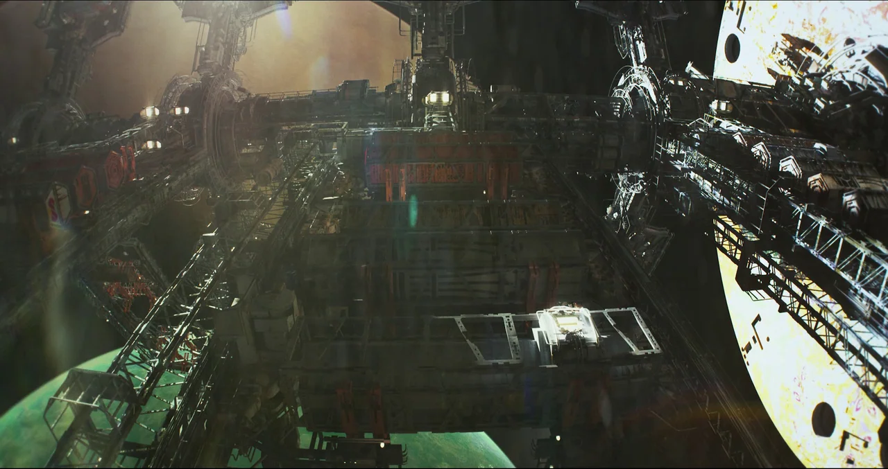 Prospect (2018) movie still: establishing — A complex, massive space station composed of steel girders and modular cargo containers. The structure…