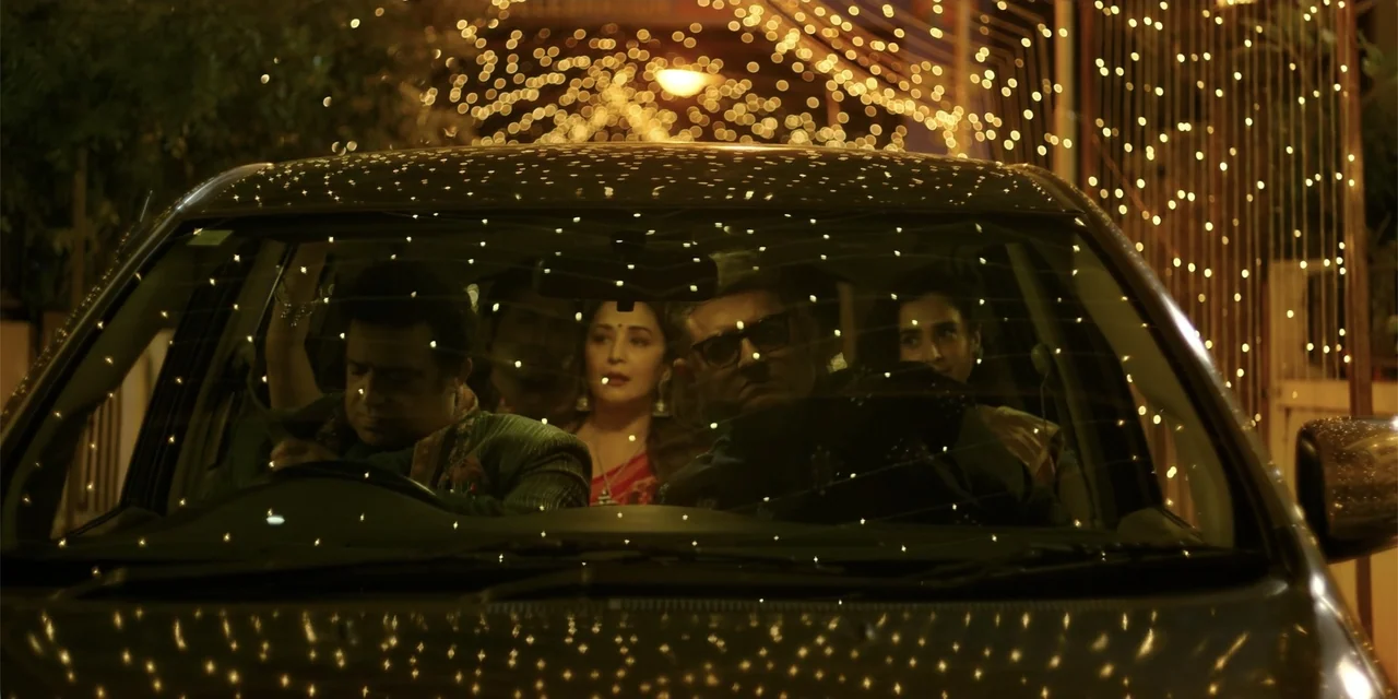 Maja Stoneface (1996) movie still: medium — Four people sit inside a car at night with visible fairy lights behind them. The subjects look forward…