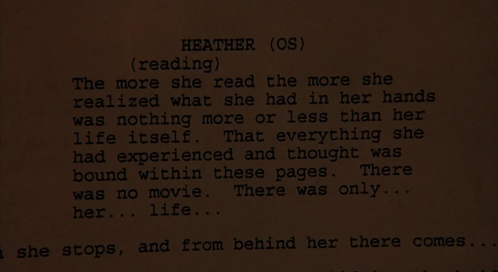 New Nightmare (1994) movie still: closeup — A dark piece of paper with black printed text fills the frame. The text describes a character reading…