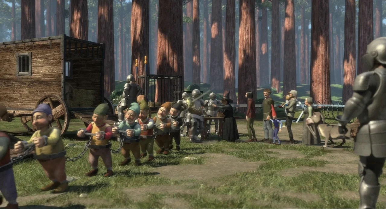 Shrek (2001) movie still: wide — A clearing in a dense redwood forest features a rustic wooden wagon and guards. A group of chained gnomes walks in…