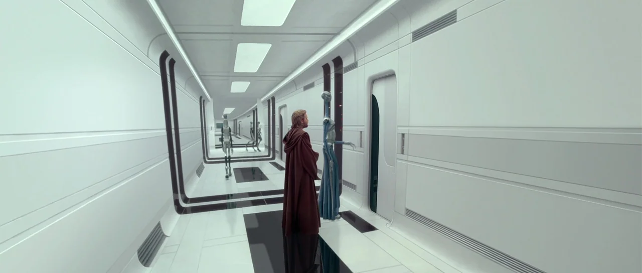 Star Wars: Episode II – Attack of the Clones (2002) movie still: fullbody — A long, sterile white corridor features rounded corners and black…