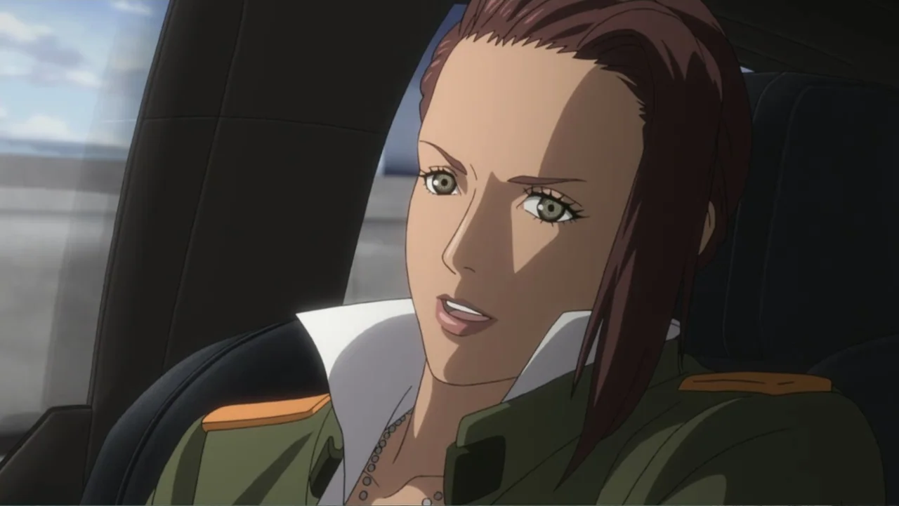 Ghost in the Shell: Arise - Border 3: Ghost Tears (2014) movie still: closeup — A woman sits inside a car during the day with soft natural light.…
