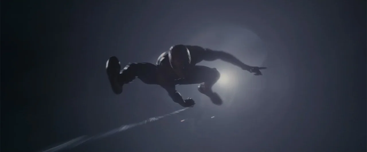 The Amazing Spider-Man (2012) movie still: medium — A dark, atmospheric tunnel interior with a single glowing light source in the background. A…
