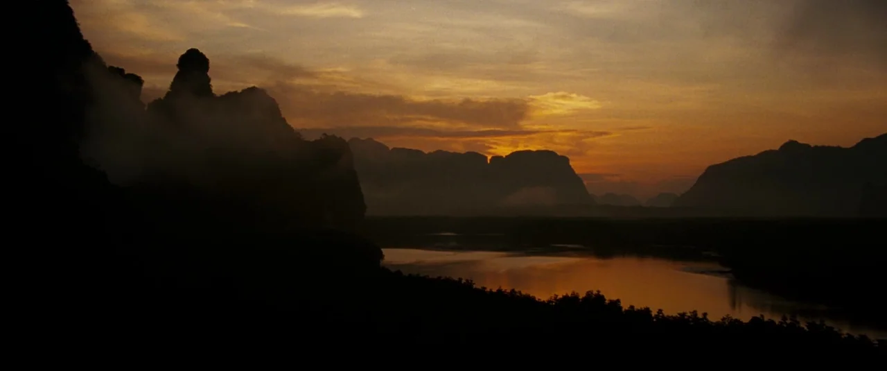 The Hangover Part II (2011) movie still: establishing — A wide landscape view features karst limestone mountains rising above a winding tropical…