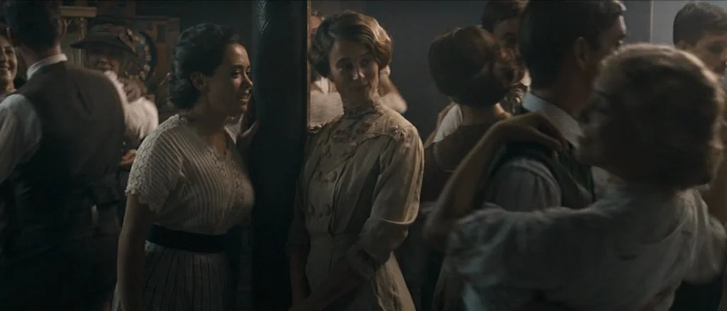 Frantz (2016) movie still: medium — A crowded 1910s dance hall with low light and soft, atmospheric focus. Multiple individuals in period-accurate…