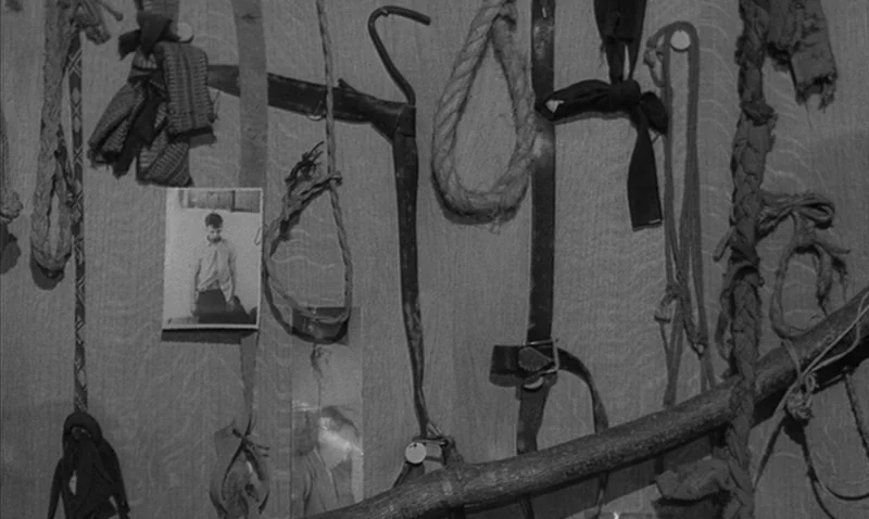 Love Affair, or the Case of the Missing Switchboard Operator (1967) movie still: closeup — A wooden wall serves as a display for various hanging…