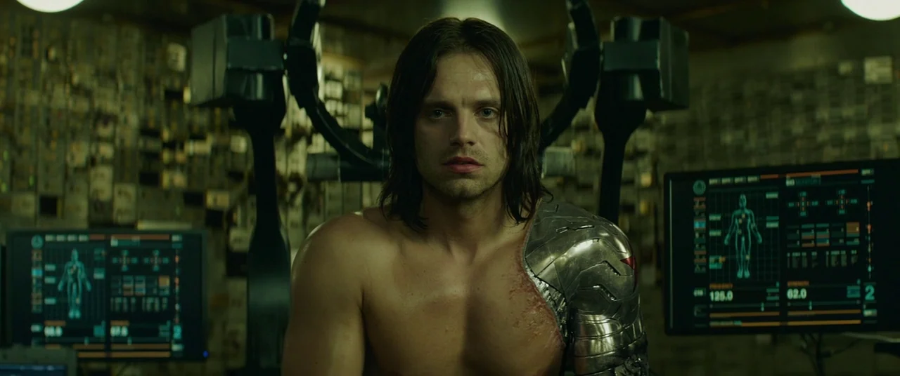 Captain America: The Winter Soldier (2014) movie still: medium — A dimly lit scientific installation features glowing monitors displaying anatomical…