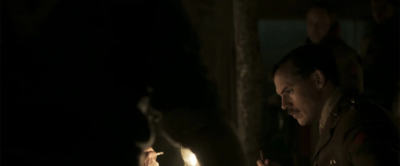 Gone Missing -  Old John's Final Journey (2014) movie still: medium — A dimly lit, shadowed bunker interior features rough textures and dark wooden…