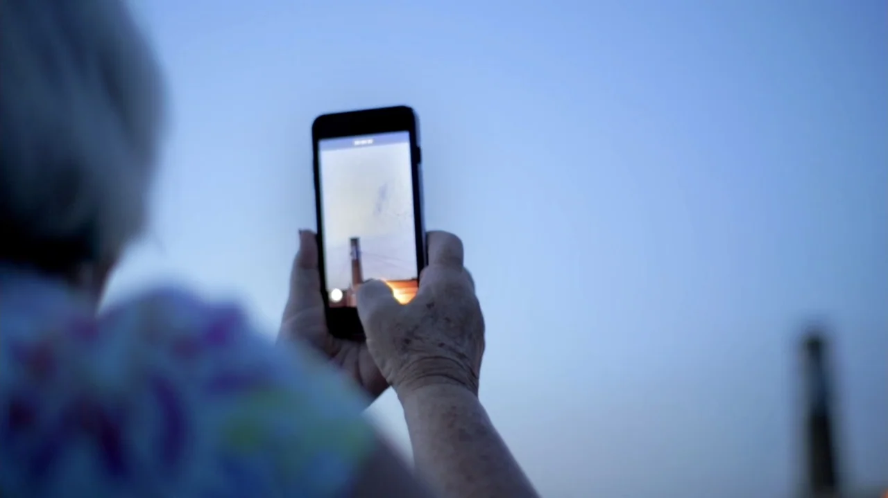 Moonlight Sonata: Deafness in Three Movements (2019) movie still: closeup — An outdoor area with a blurred horizon and sky during the blue hour. An…