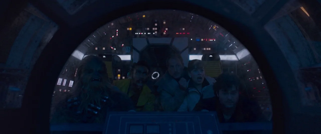 Solo: A Star Wars Story (2018) movie still: medium — The interior of a spaceship cockpit has multiple glowing instrument panels and technical…