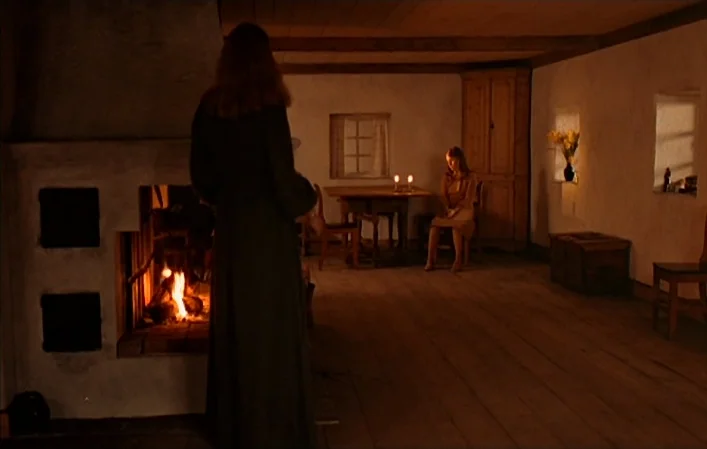 Autumn Sonata (1978) movie still: wide — A rustic interior with white plaster walls, wooden ceiling beams, and a plank floor. A woman stands by a…