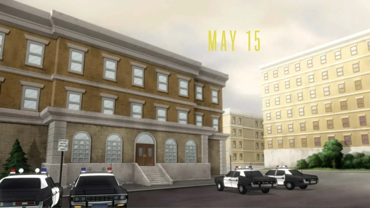 Batman: Year One (2011) movie still: establishing — A multi-story brick building serves as a police station with stone foundation elements. Several…