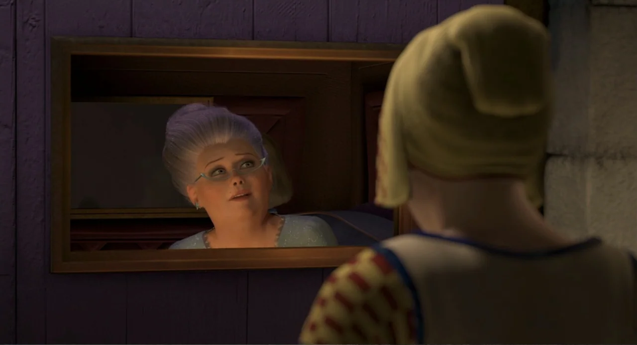 Shrek 2 (2004) movie still: medium — A room with purple vertical wood paneled walls contains a large wooden framed mirror. A woman stares into the…