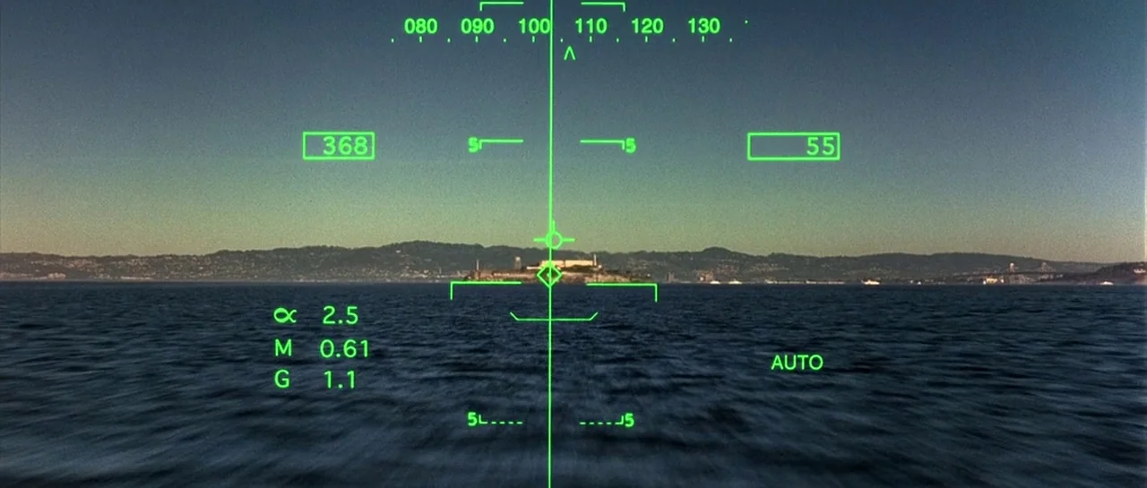 The Rock (1996) movie still: establishing — A view across San Francisco Bay toward Alcatraz Island during a clear day. A green digital heads-up…