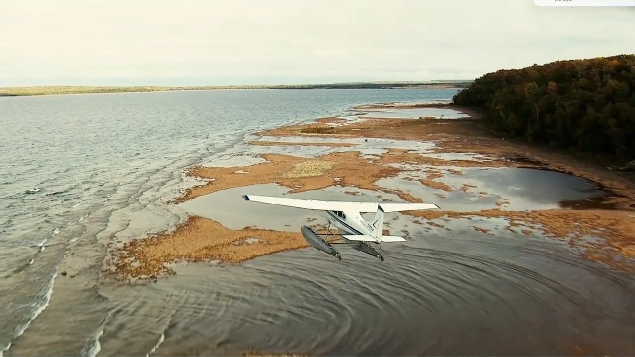 National Parks Adventure (2016) movie still: wide — A remote coastal area features tidal pools and sparse vegetation along a rocky shoreline. A…
