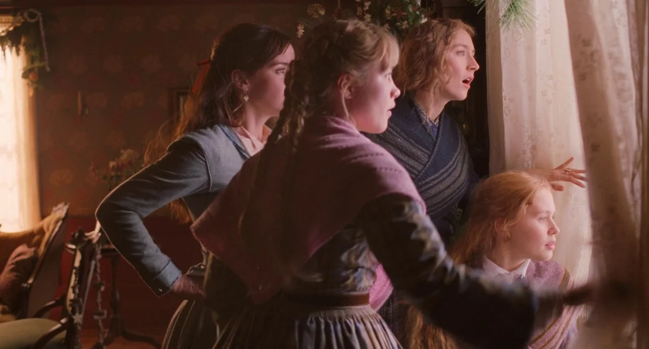 Little Women (2019) movie still: medium — Four young women gather in a 19th-century parlor looking out through a white curtain. The room is…