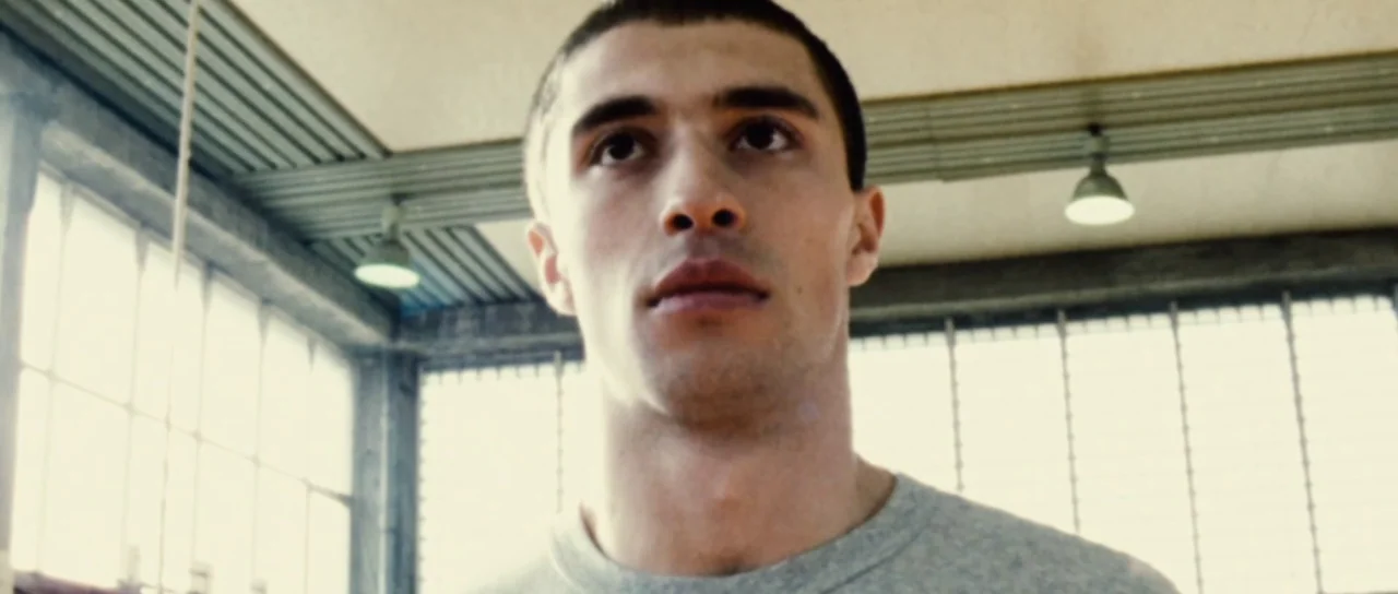 Universal Soldier: Regeneration (2009) movie still: closeup — A high-ceilinged athletic facility with industrial windows and structural beams in the…