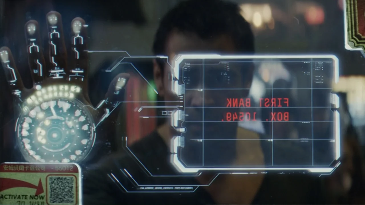 Total Recall (2012) movie still: medium — A dark indoor space features a translucent interactive touch-screen overlay with digital red text. A man…